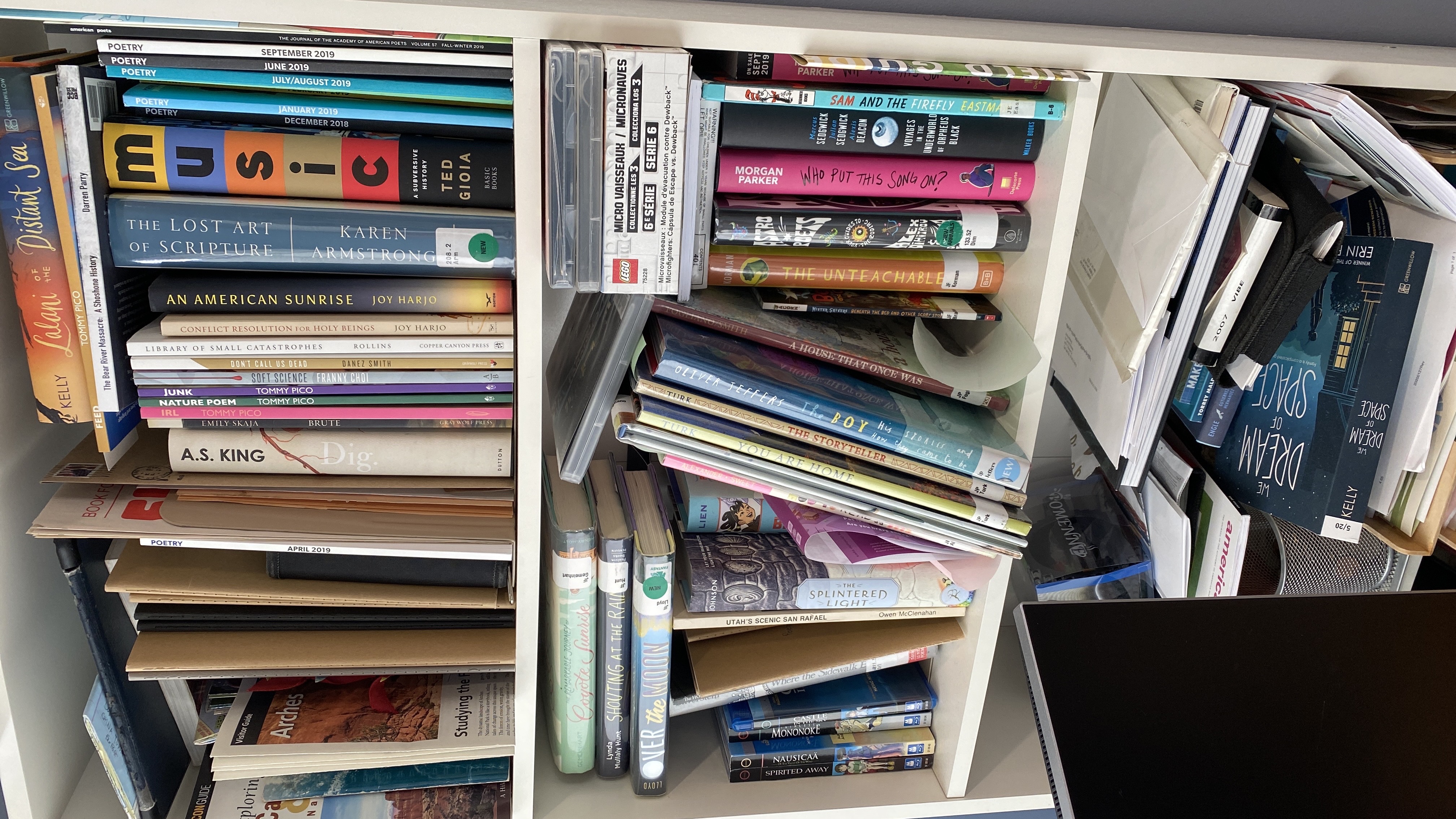 Bookshelf by my desk full of books to read, review, or take back to the library if libraries ever open up again. Also, other things to do.